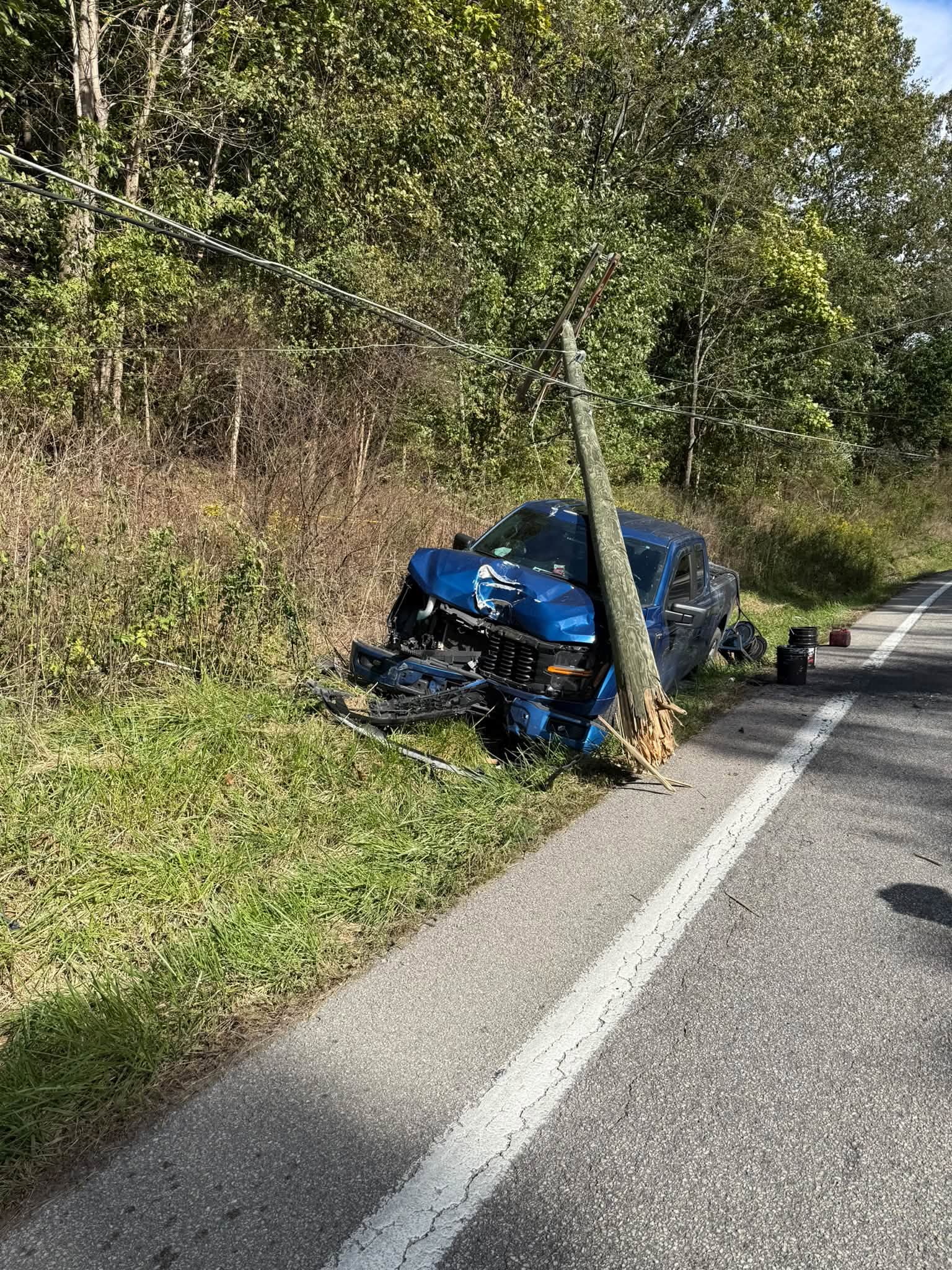 Harrison County firefighters respond to vehicle accident that causes brush fire on Buckhannon Pike, one person airlifted